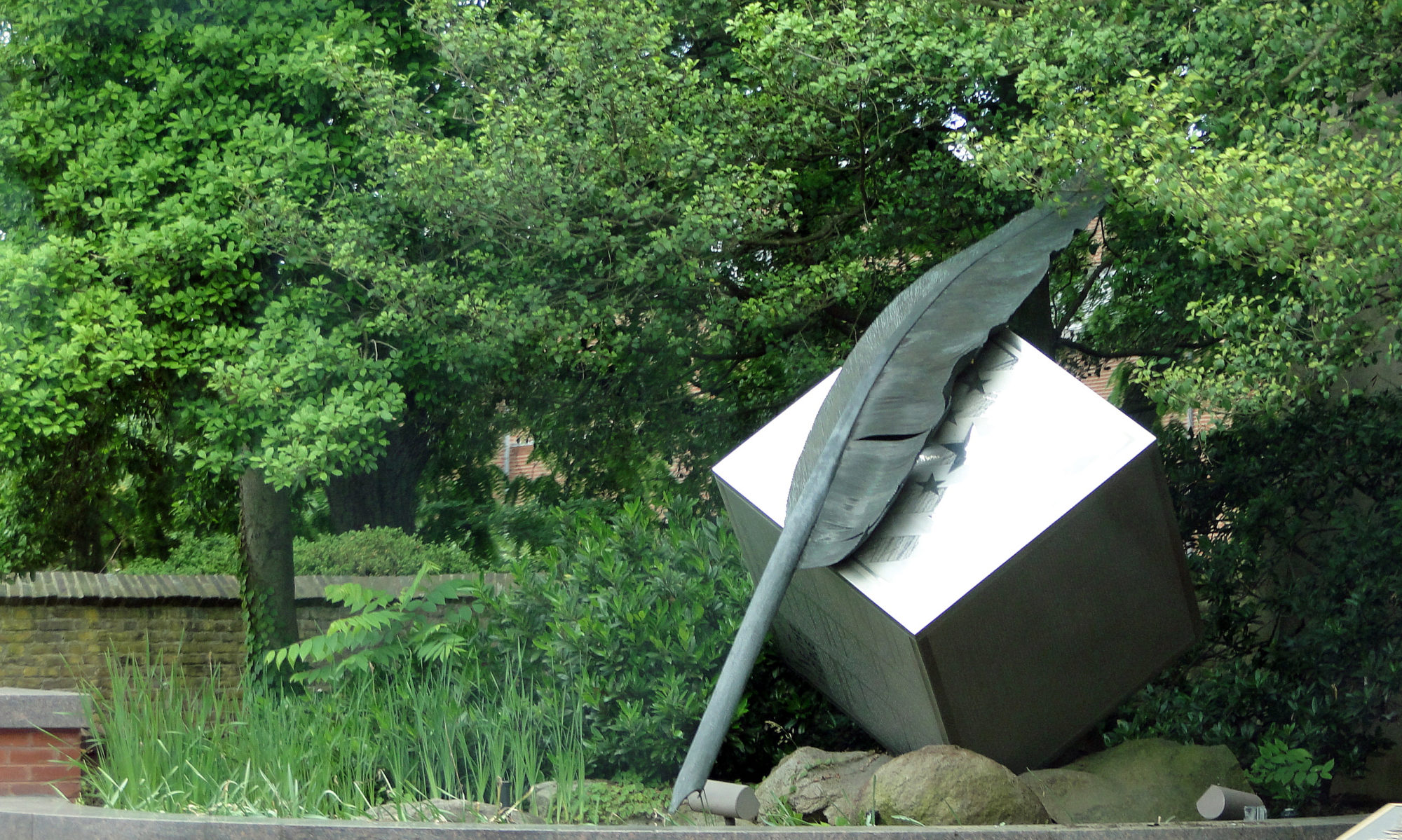 statue showing a feather pen sitting on a metalic block in Dover