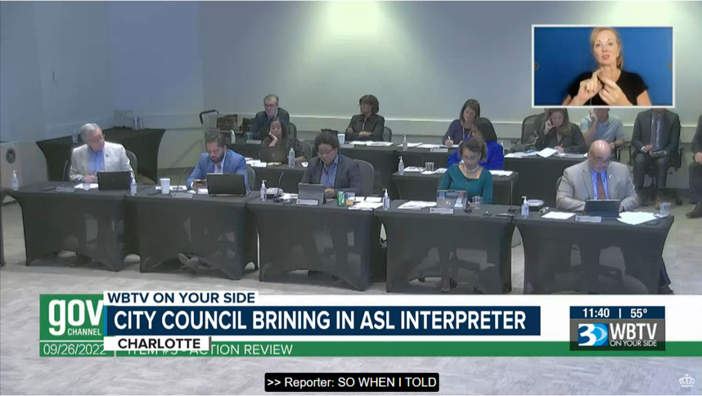 ASL interpreter shown in upper right corner of Charlotte City, NC council meeting.  Screenshot from the news channel video for an example.